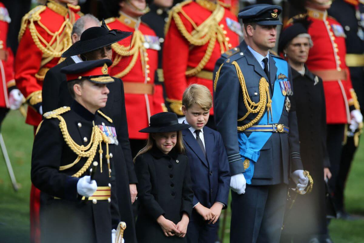 Prince George, Princess Charlotte, and Prince William, look on at Queen Elizabeth II's coffin following her State Funeral