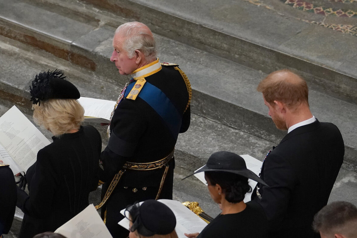 Prince Harry and Meghan Markle sit behind King Charles and Queen Camilla at Queen Elizabeth II's funeral