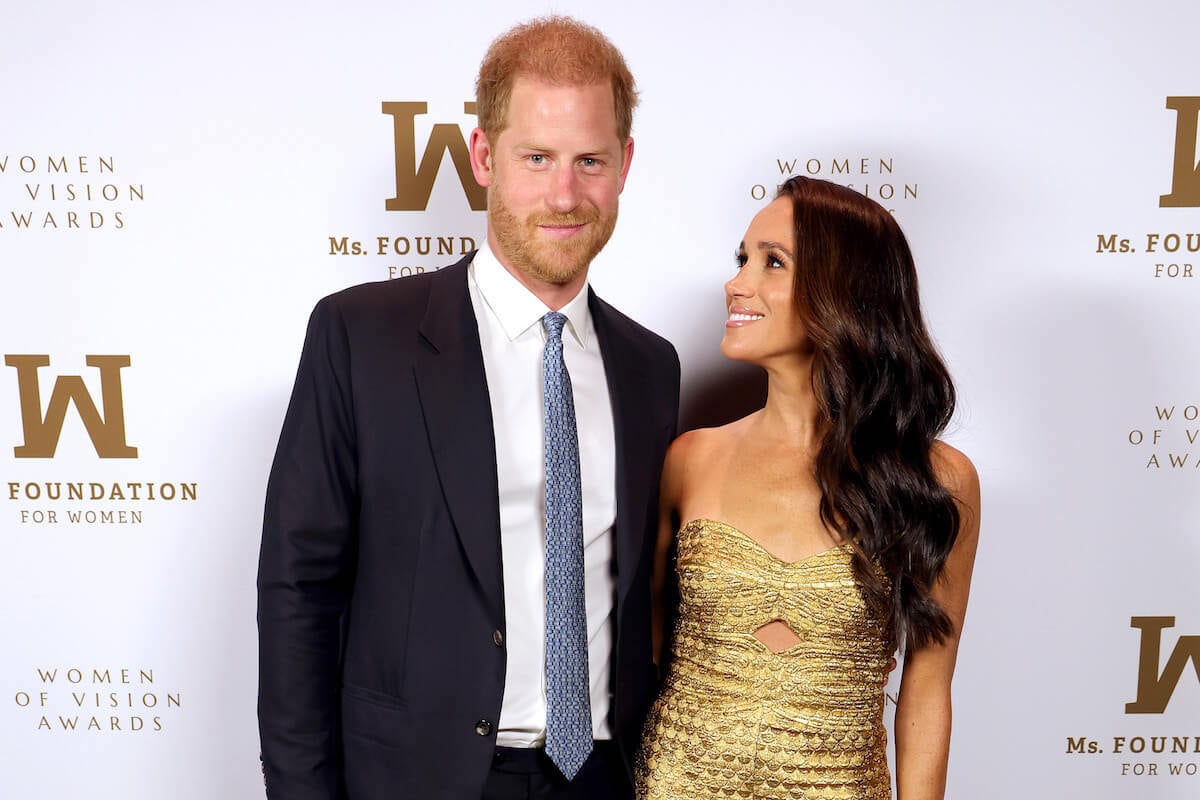 Prince Harry and Meghan Markle, who wouldn't be as popular as Zara and Mike Tindall in Hollywood, pose together