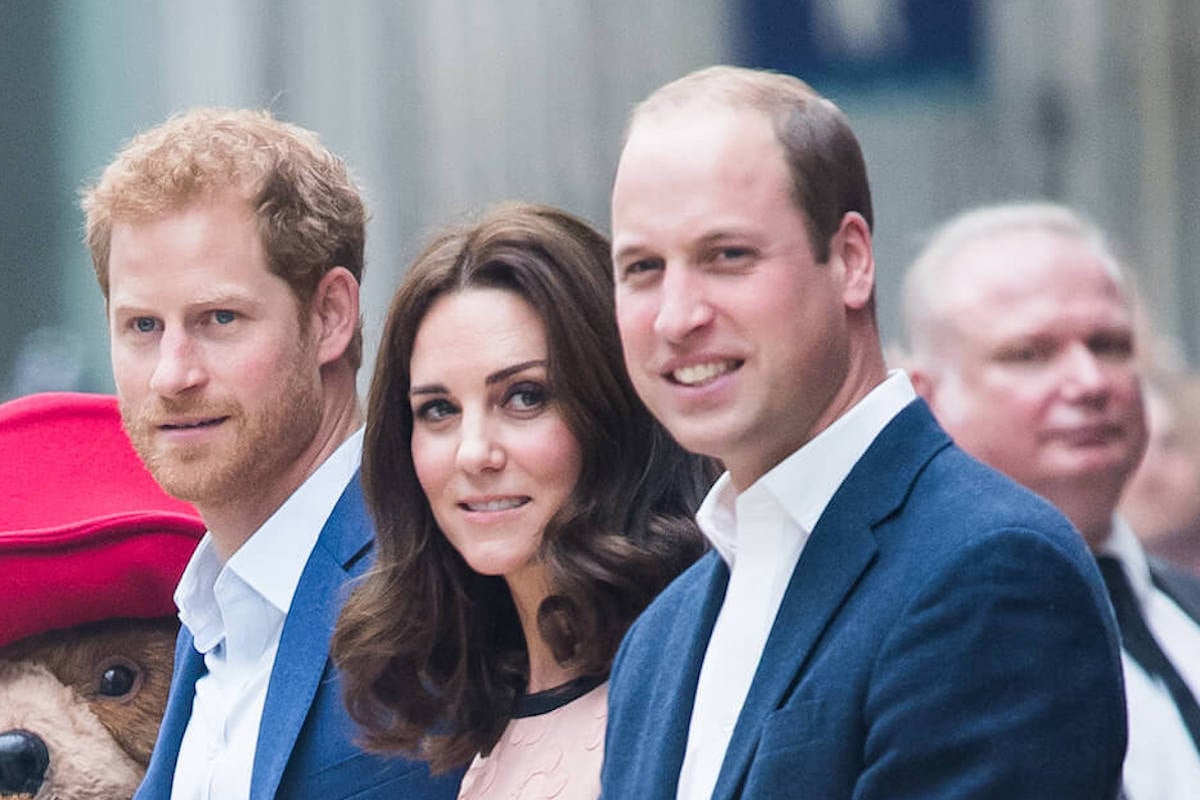 Prince Harry and Prince William, whose 'tougher obstacle' to reconciliation has to do with Kate Middleton, stand with the now-Princess of Wales
