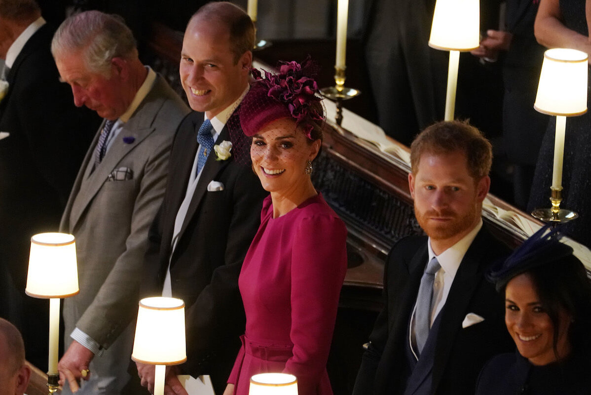 Prince Harry, who has a chance to someday represent the royal family, stands with King Charles, Prince William, Kate, and Meghan Markle