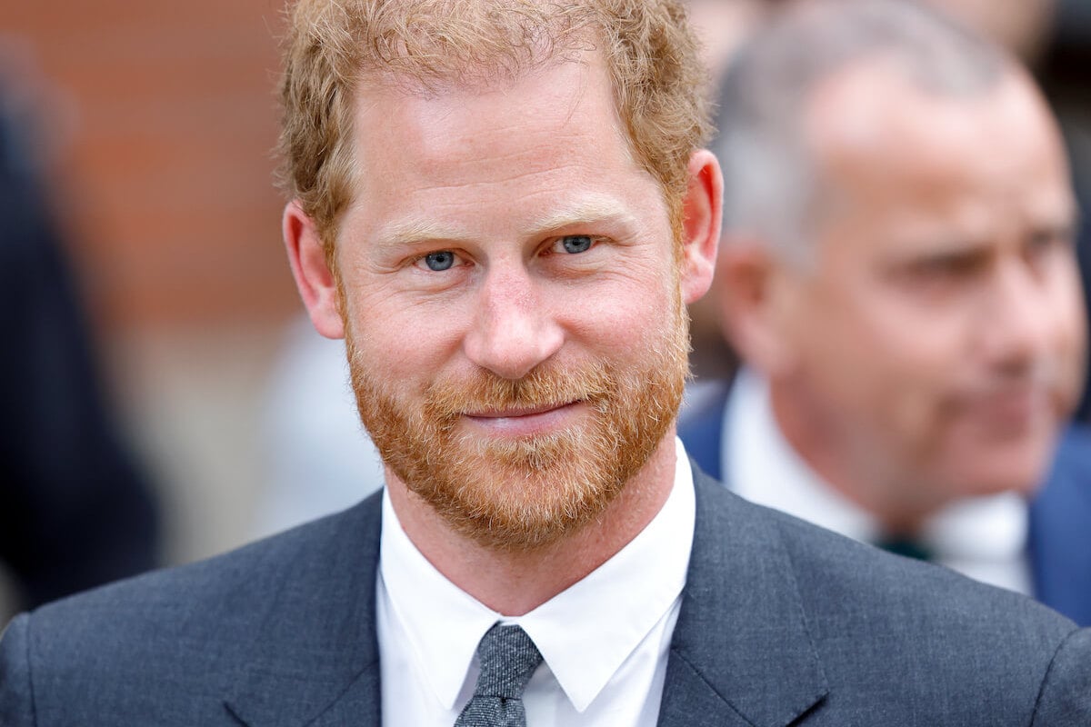 Prince Harry, who may have a chance at representing the royal family, smiles