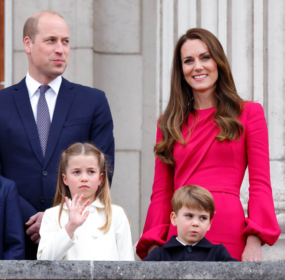 Prince William, Princess Charlotte, Kate Middleton, and Prince Louis standing on the balcony of Buckingham Palace following the Platinum Pageant