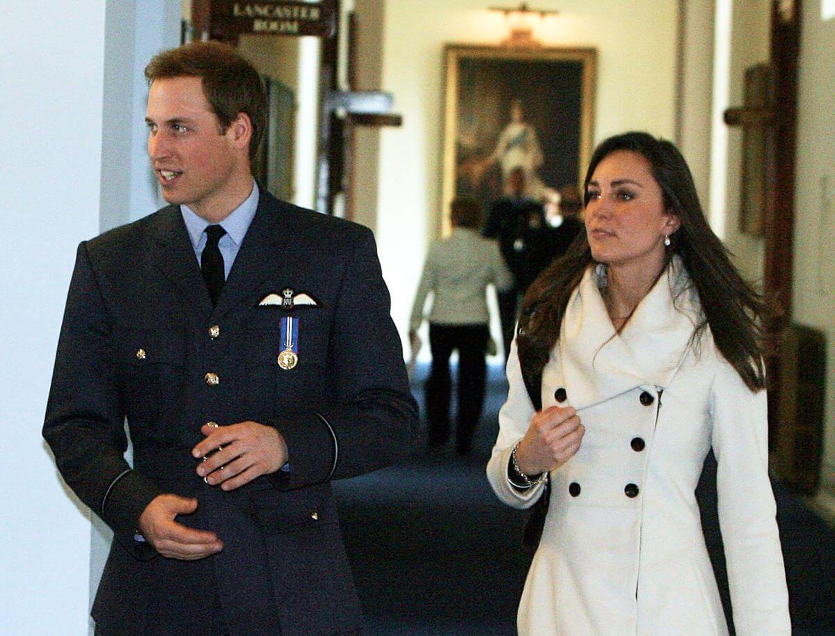Prince William and Kate Middleton walking together at the Central Flying School