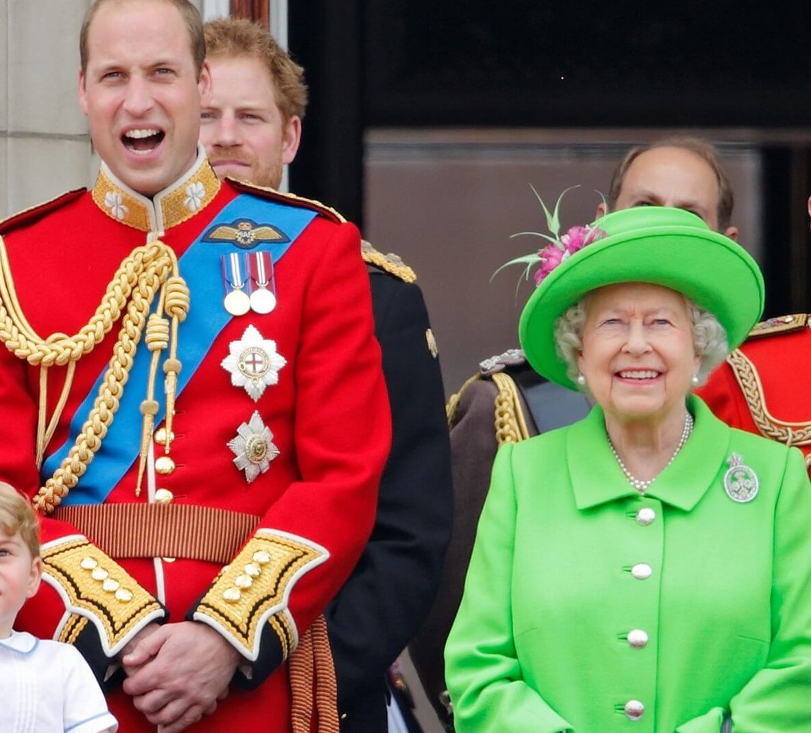 Prince William and Queen Elizabeth II watch the flypast from the balcony of Buckingham Palace during Trooping the Colour