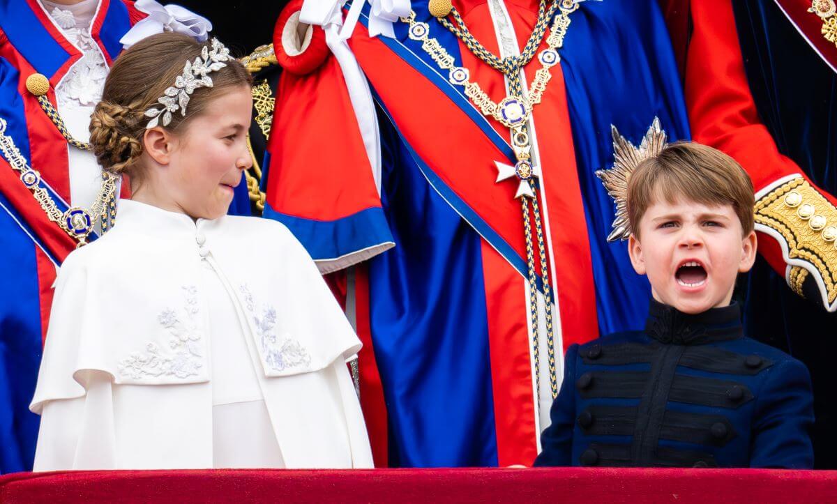 Princess Charlotte and Prince Louis on the balcony of Buckingham Palace following the coronation of King Charles III and Queen Camilla
