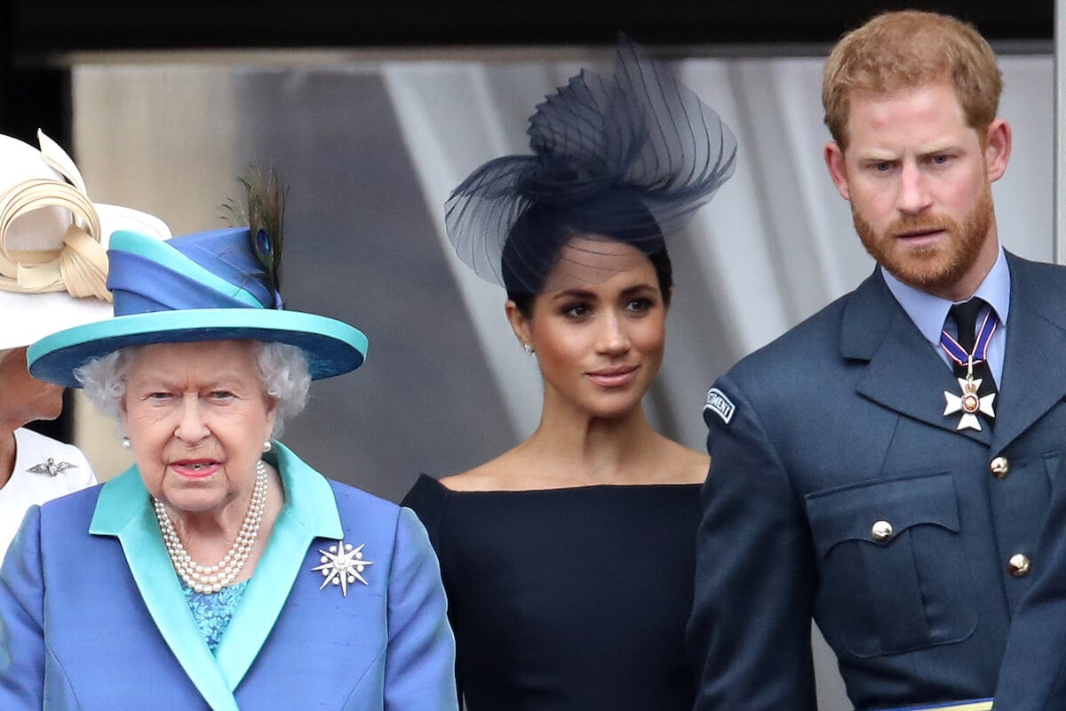 Queen Elizabeth II, whose memory is hurt by Prince Harry, Meghan Markle Princess Lilibet name claim in biography, stands with the couple and looks on
