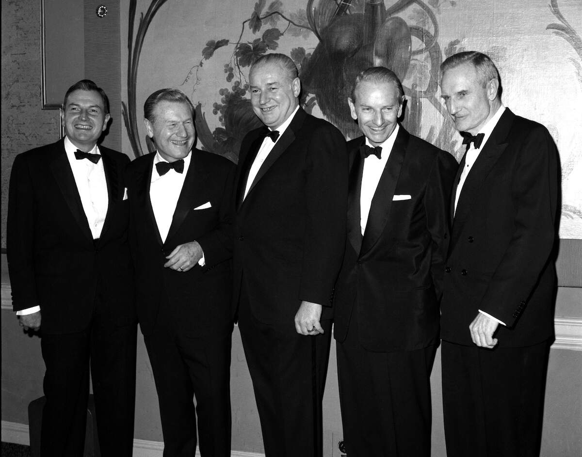 Wearing black tuxedos, five Rockefeller brothers pose together for first time in seven years to be honored by National Institute of Social Sciences in 1967