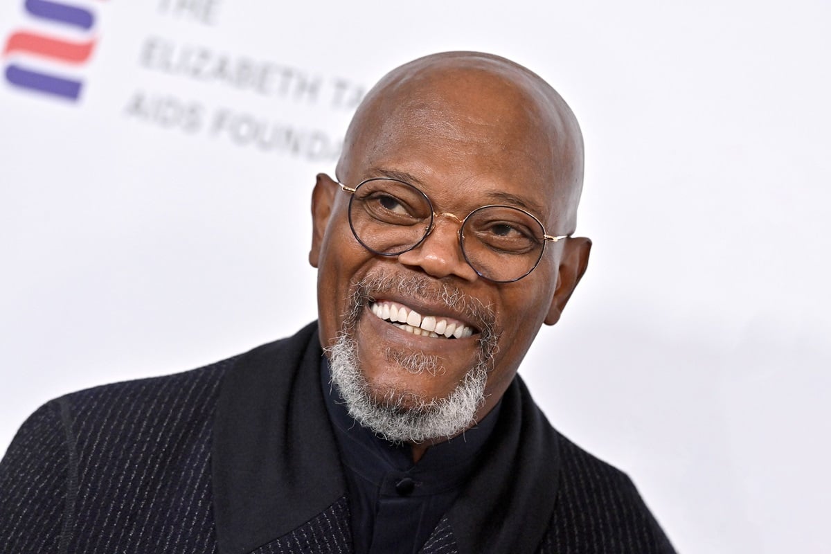 Samuel L. Jackson posing at the Elizabeth Taylor Ball to End AIDS at The Beverly Hills Hotel in a black suit.