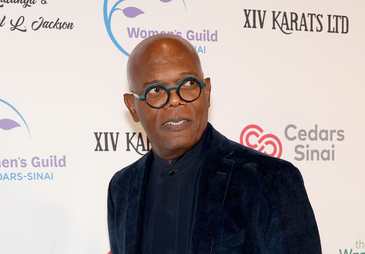 Samuel L. Jackson posing in a black suit at the 2023 Women's Guild Cedars Sinai Crystal Ball honoring Samuel and Latanya Jackson at Beverly Wilshire.