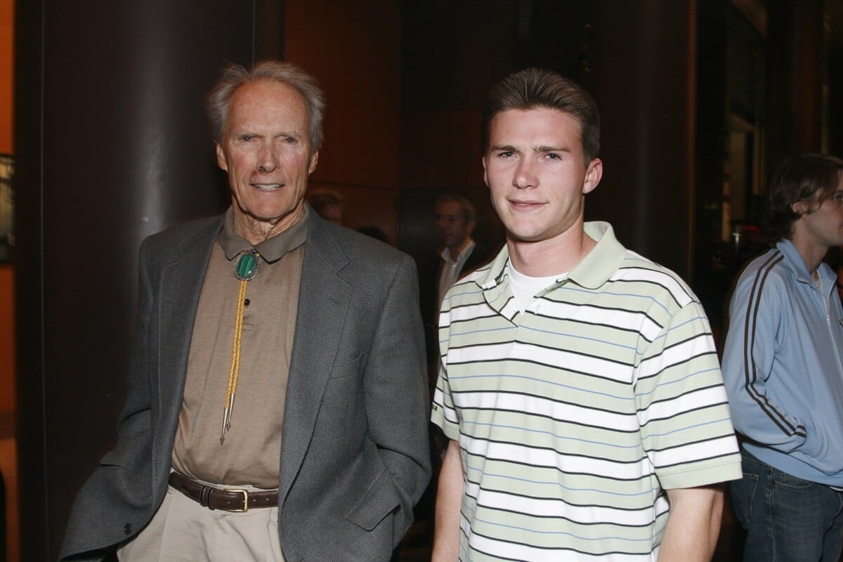 Clint Eastwood posing next to his son Scott Eastwood at the screening of 'Pride'.