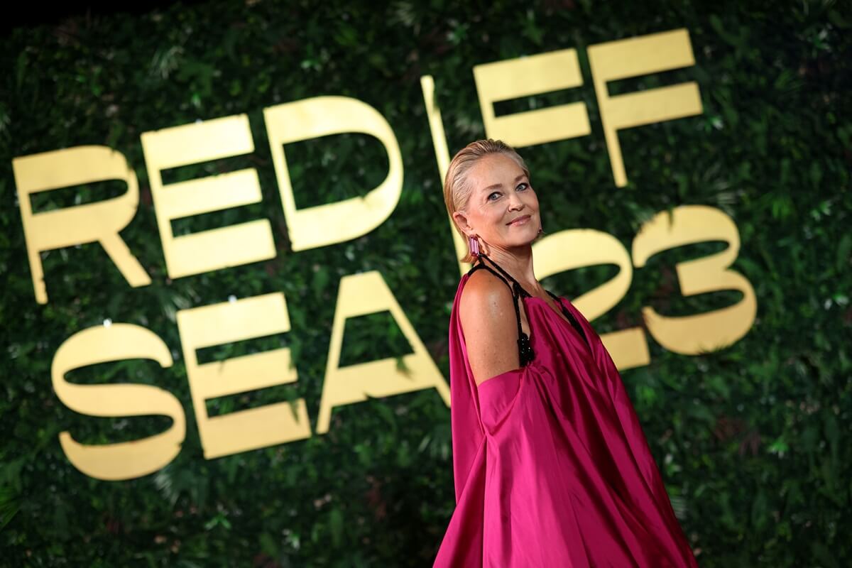 Sharon Stone posing in a pink dress at the Opening Night screening of "HWJN" at the Red Sea International Film Festival 2023