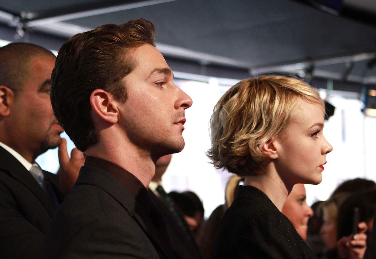Both frowning, Shia LaBeouf and Carey Mulligan attend the opening bell ringing ceremony at the NASDAQ MarketSite on September 20, 2010
