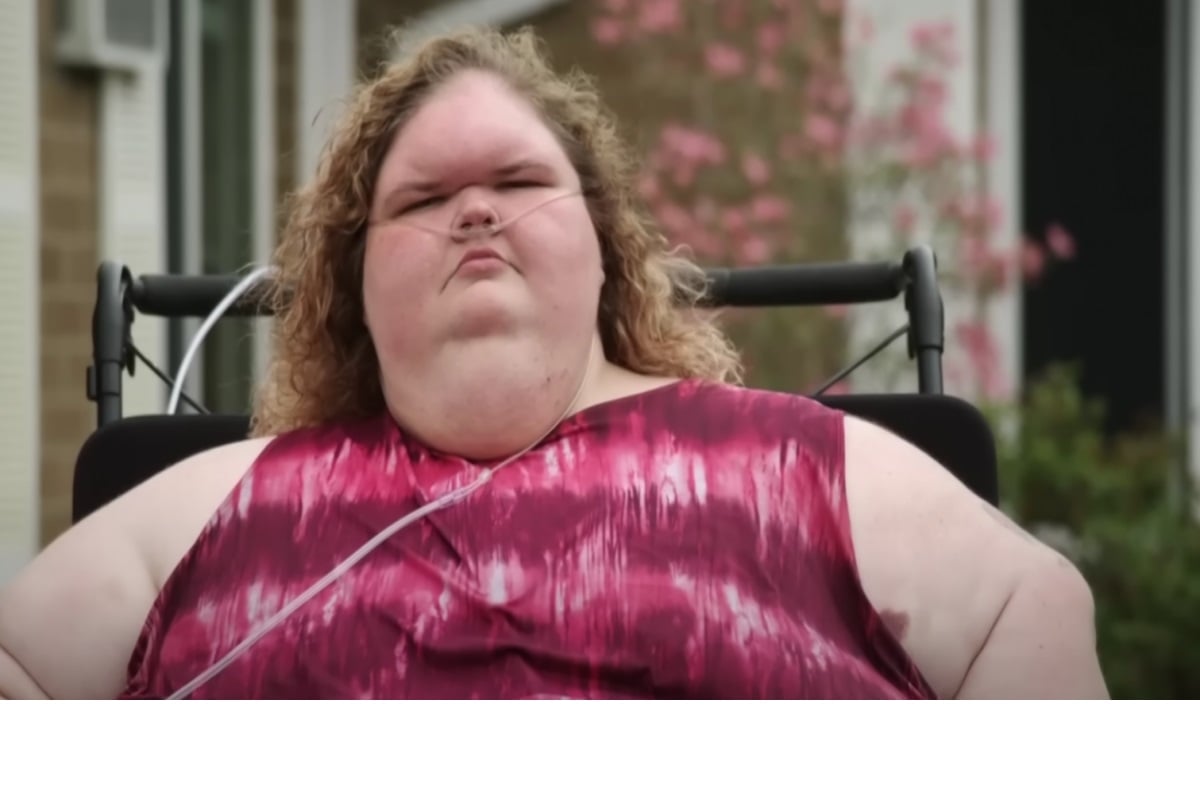 Tammy Slaton sitting down in a pink shirt on the show '1000-lb Sisters'.