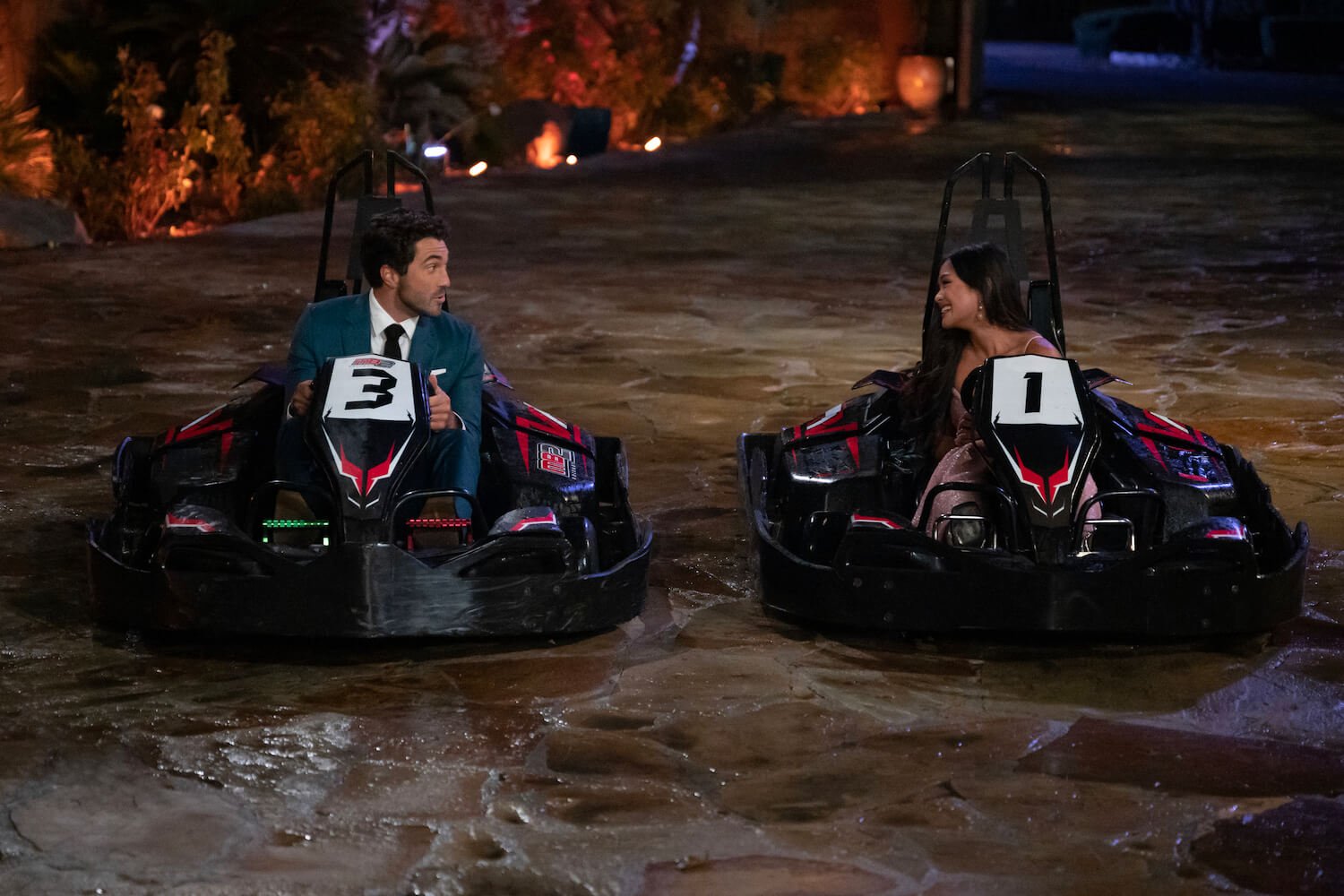 'The Bachelor' Season 28 star Joey Graziadei in a go-kart next to Jenn Tran on night 1