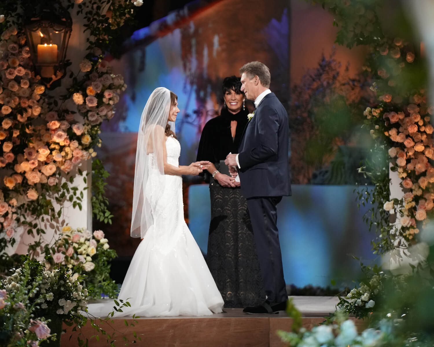 'The Golden Bachelor' couple Theresa Nist and Gerry Turner facing each other while getting married on their wedding day