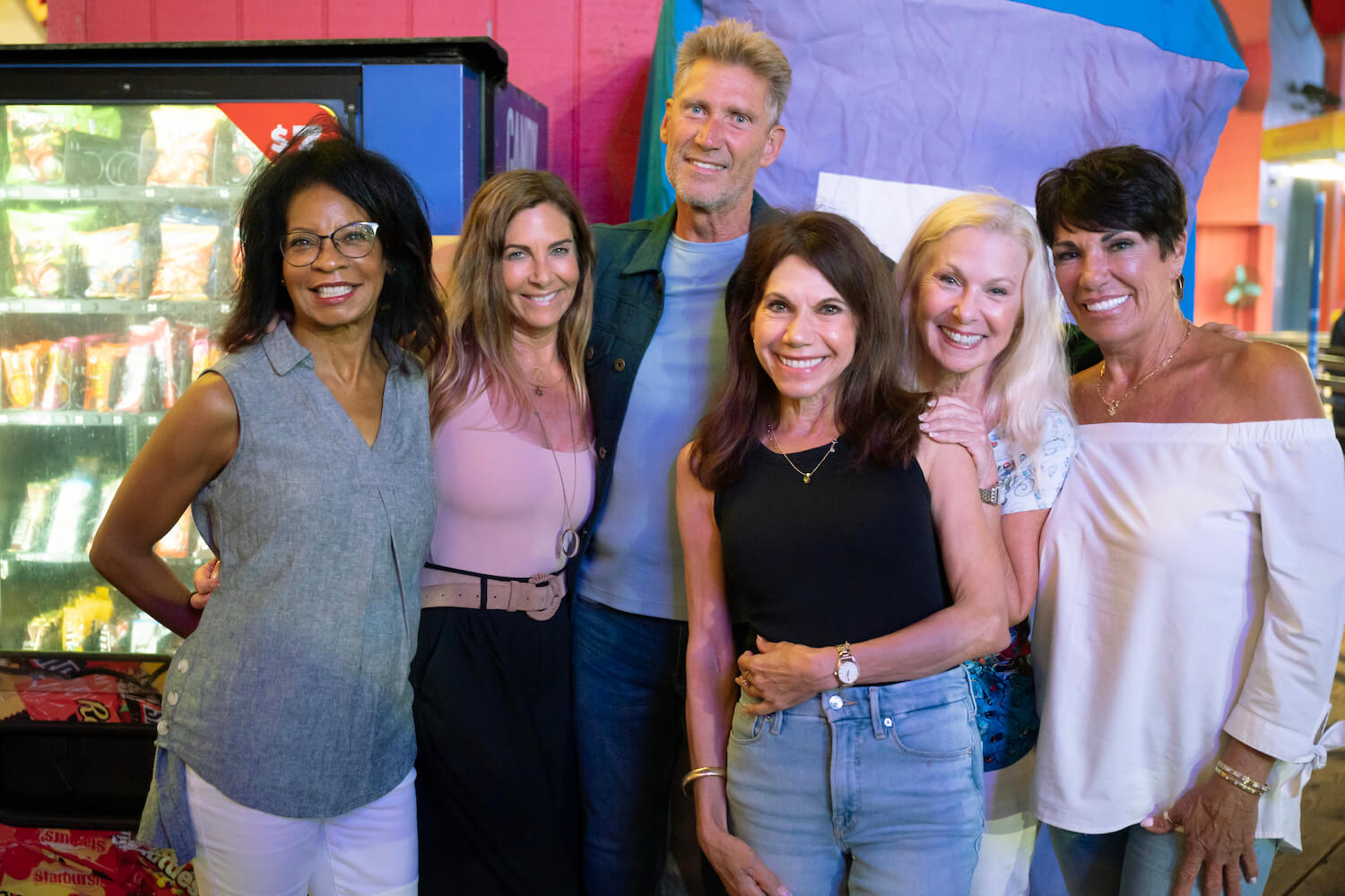 'The Golden Bachelor' star Gerry Turner posing with several women from his season, including Theresa Nist