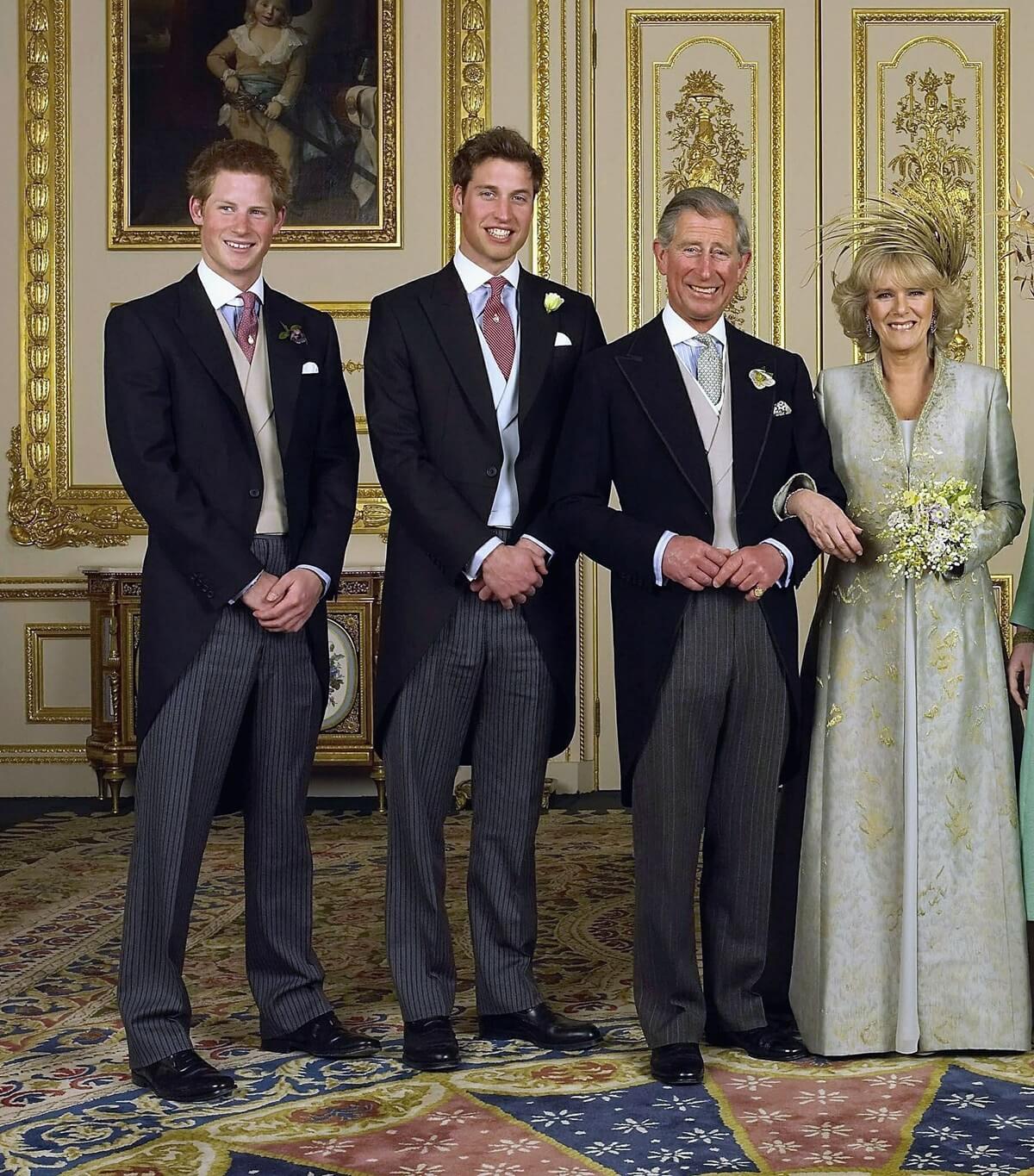 Then-Prince Charles and Camilla Parker Bowles pose for a wedding photo with Prince William and Prince Harry