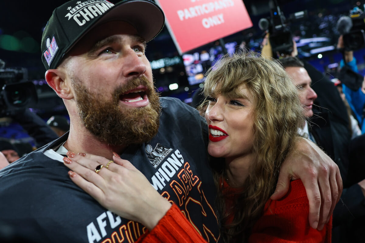 Travis Kelce, whose mother Donna Kelce's body language indicated approval of Taylor Swift, stands with Taylor Swift after the Chiefs AFC championship win