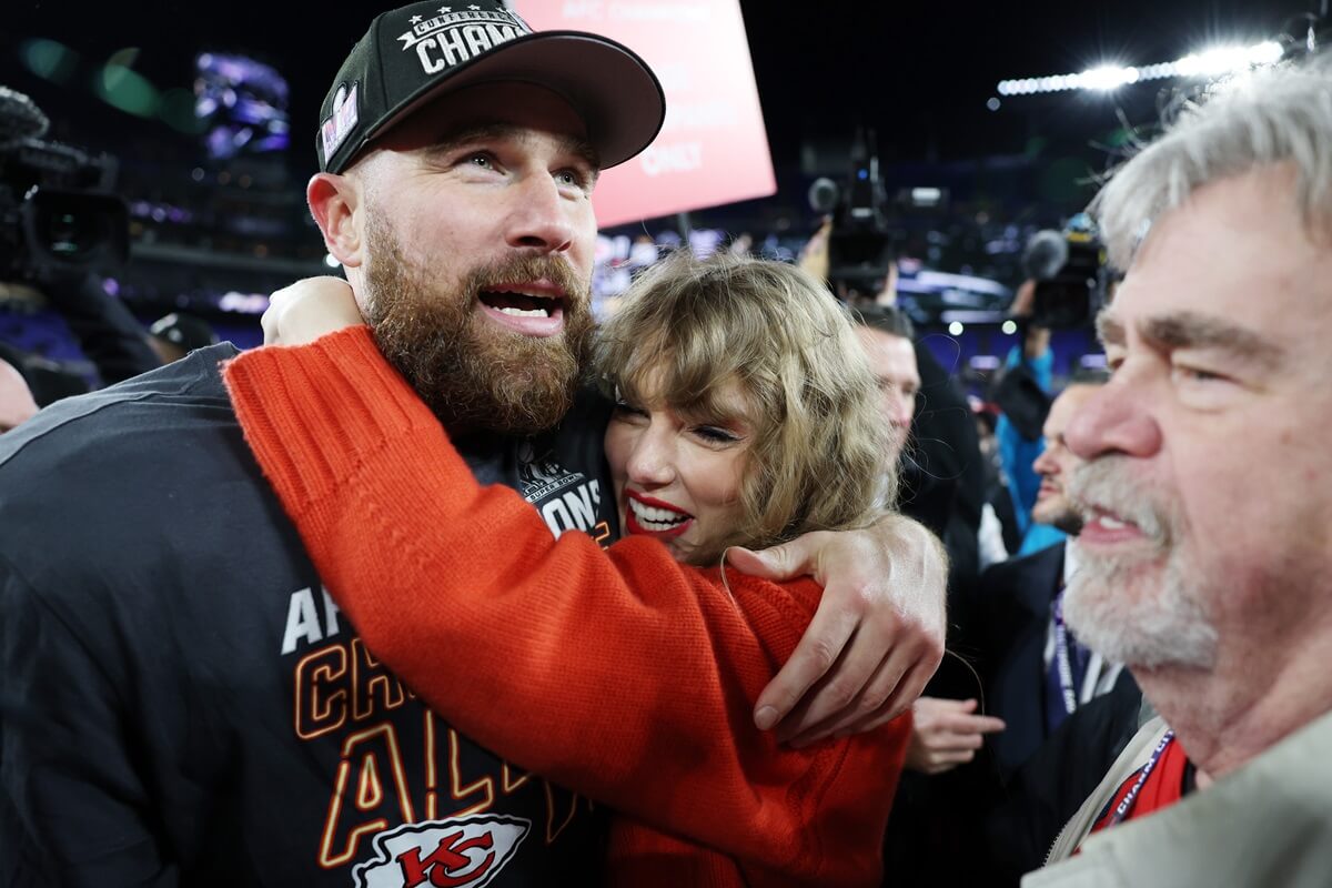 Travis Kelce's father, Ed, on the field with his son and Taylor Swift after the Chiefs beat the Baltimore Ravens in the AFC Championship game