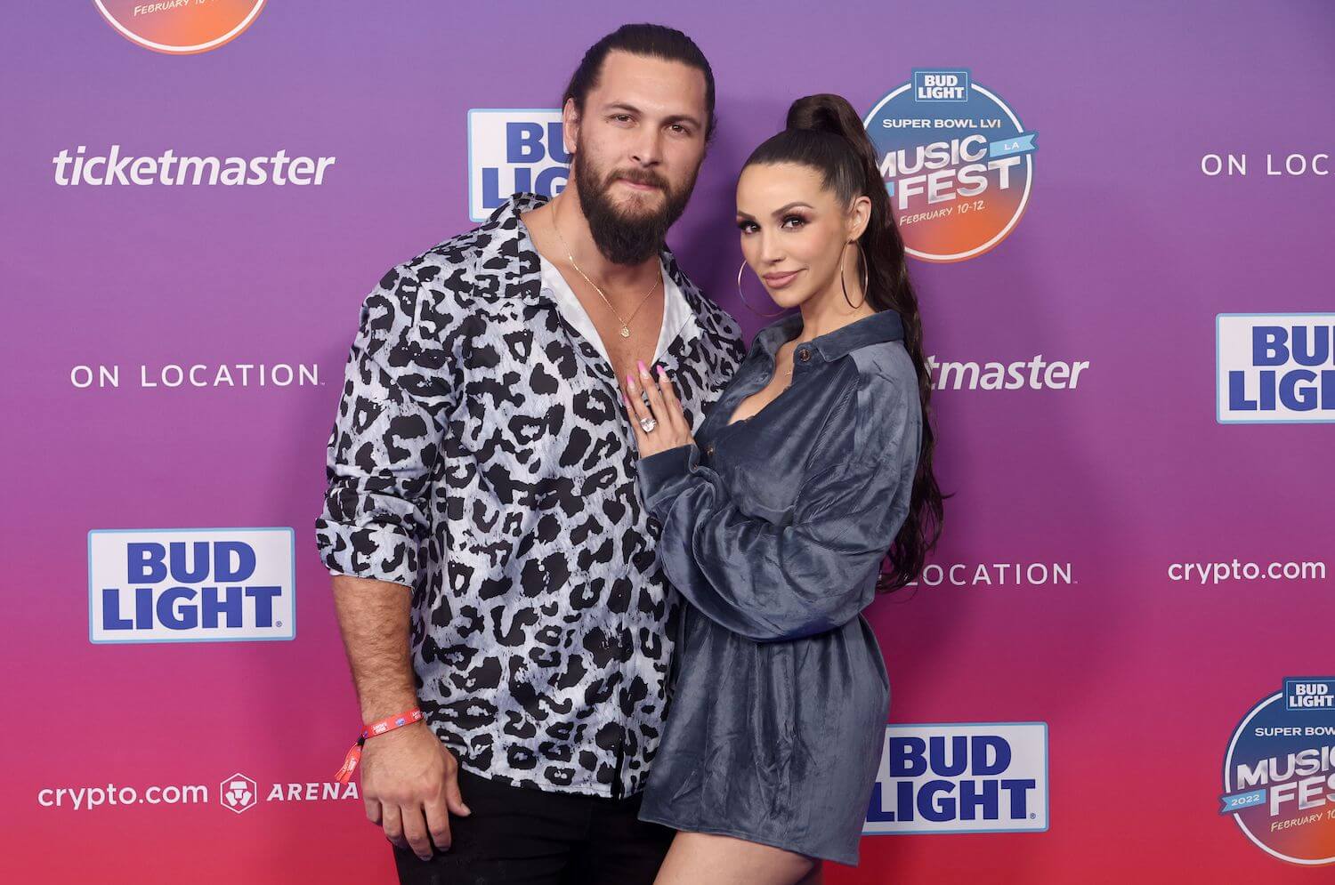 'Vanderpump Rules' stars Brock Davies and Scheana Shay standing closely side by side at an event