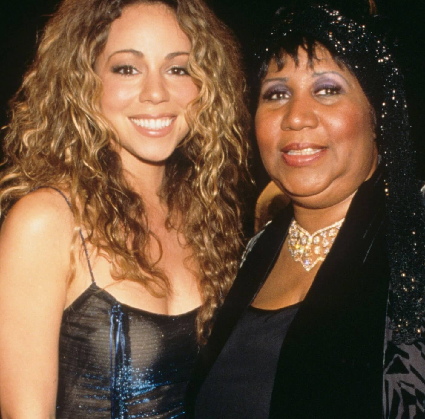 Mariah Carey and Aretha Franklin smiling