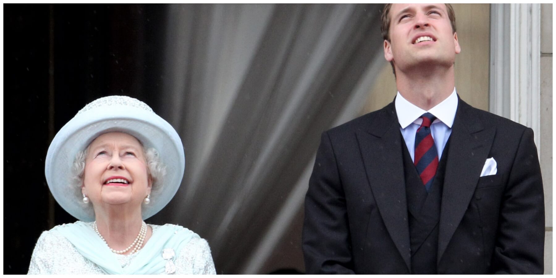 Queen Elizabeth and Prince William look toward the skies on the Buckingham Palace balcony in 2012.