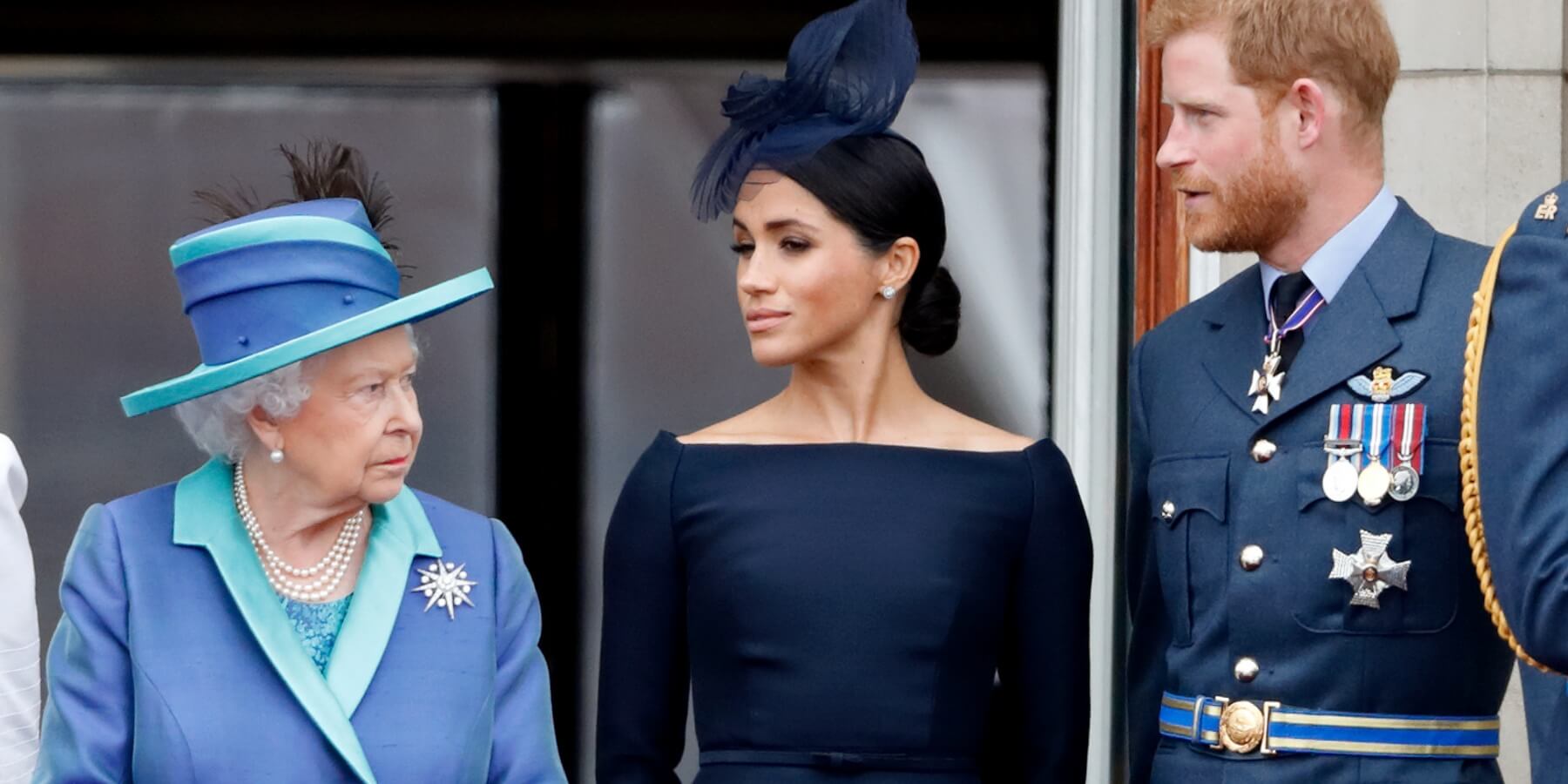 Queen Elizabeth, Meghan Markle, and Prince Harry on the Buckingham Palace balcony in 2018.