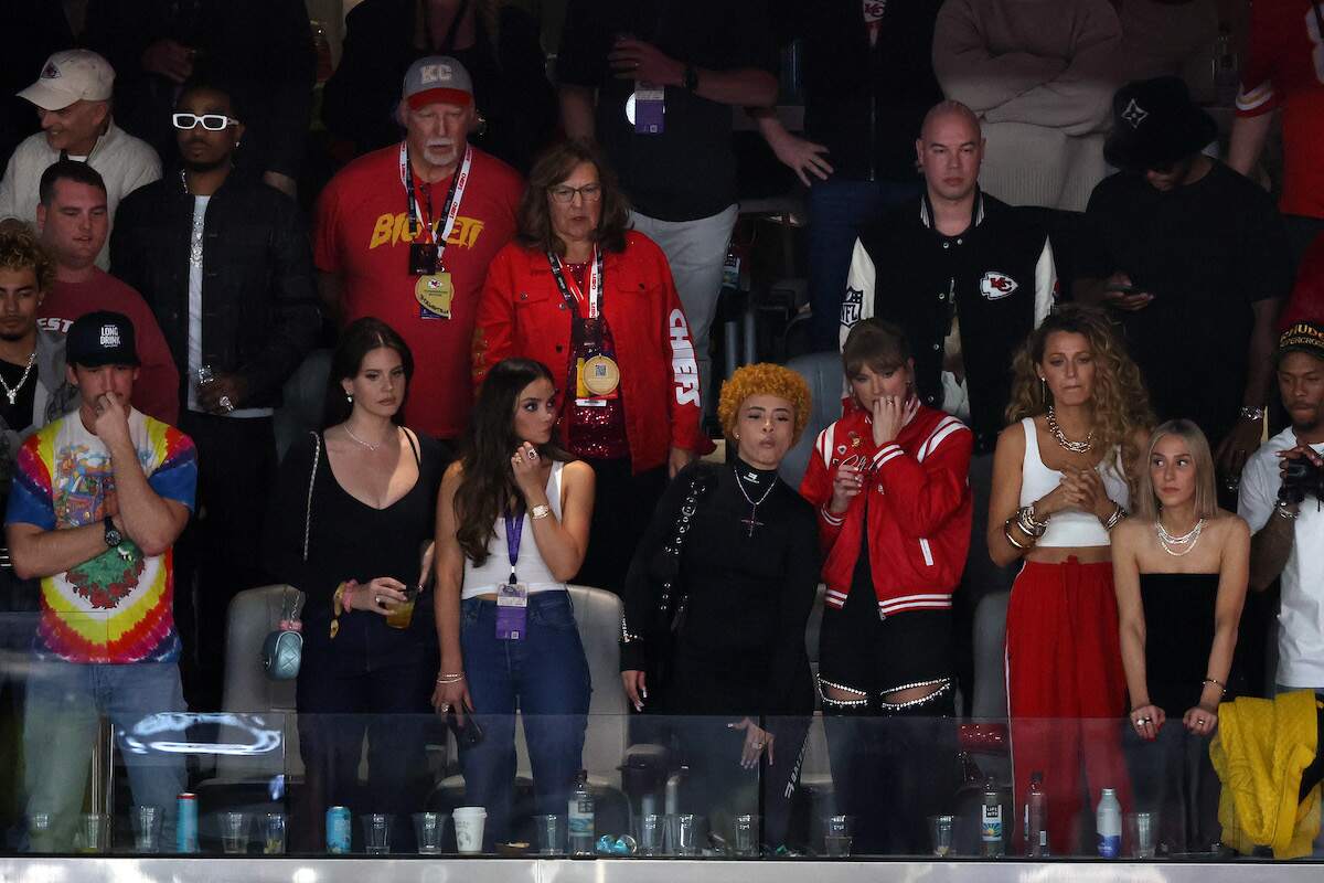 Miles Teller sits with Lana Del Rey, singer Ice Spice, singer Taylor Swift, and actress Blake Lively in a suite at Super Bowl LVIII