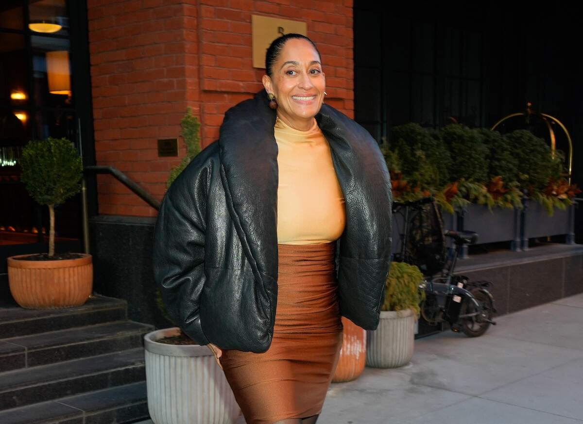 Actor Tracee Ellis Ross leaves her hotel wearing a copper skirt, taupe top, and leather puffer coat