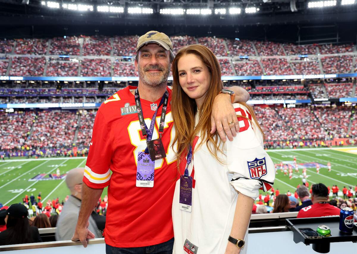 Now-married couple Jon Hamm and Anna Osceola pose and smile together during the Super Bowl LVIII Pregame