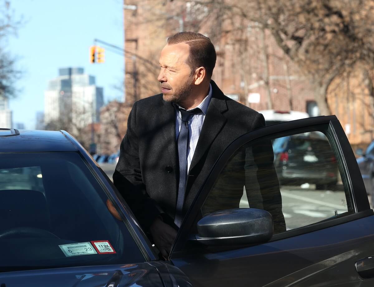 Donnie Wahlberg getting into a car