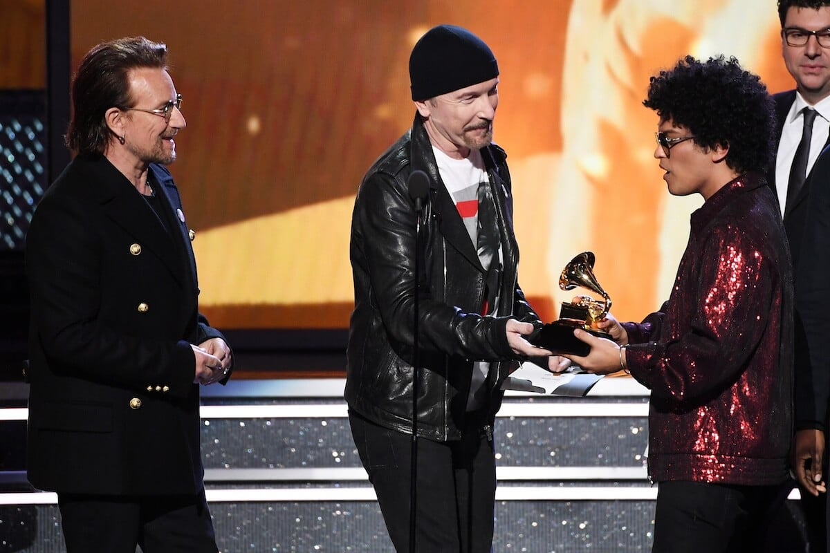 Bono and The Edge presenting an award to Bruno Mars at the Grammy Awards