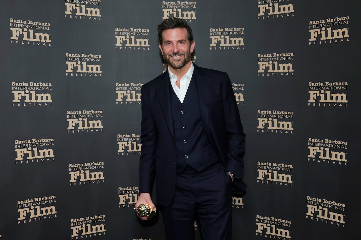 Bradley Cooper holding his award at the SBIFF