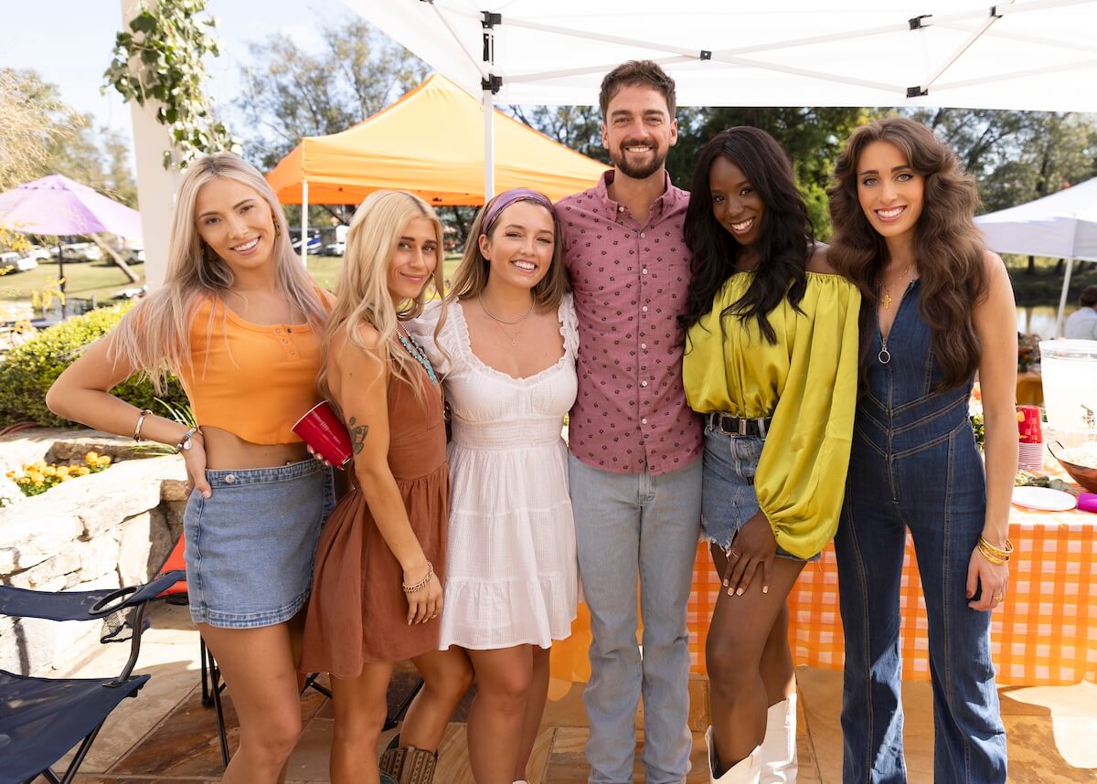 Brandon posing with five women on 'Farmer Wants a Wife' Season 2