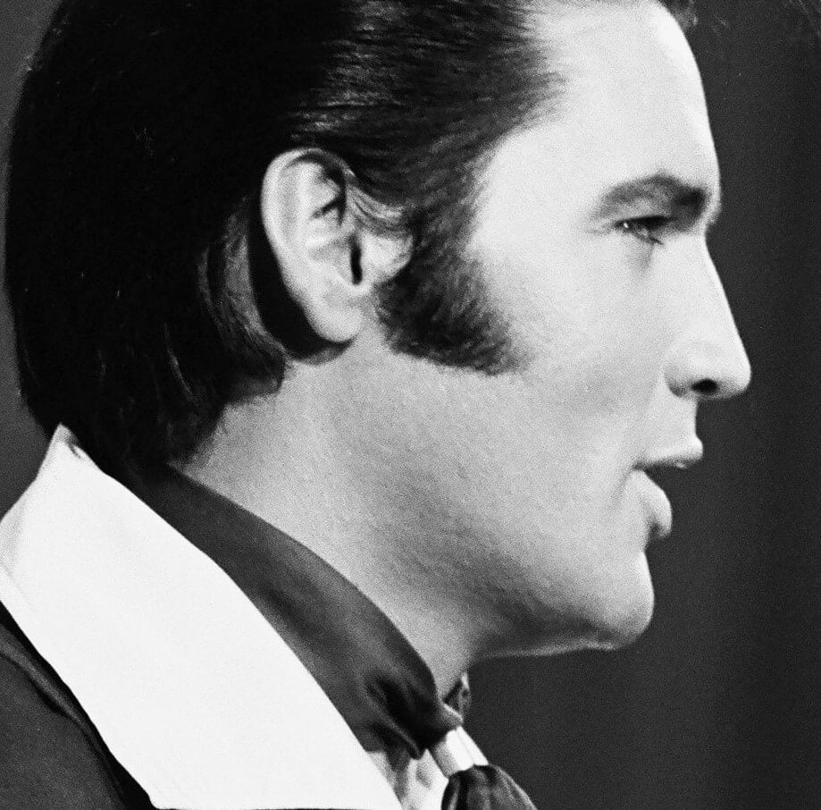 "(You're the) Devil in Disguise" singer Elvis Presley wearing a collar