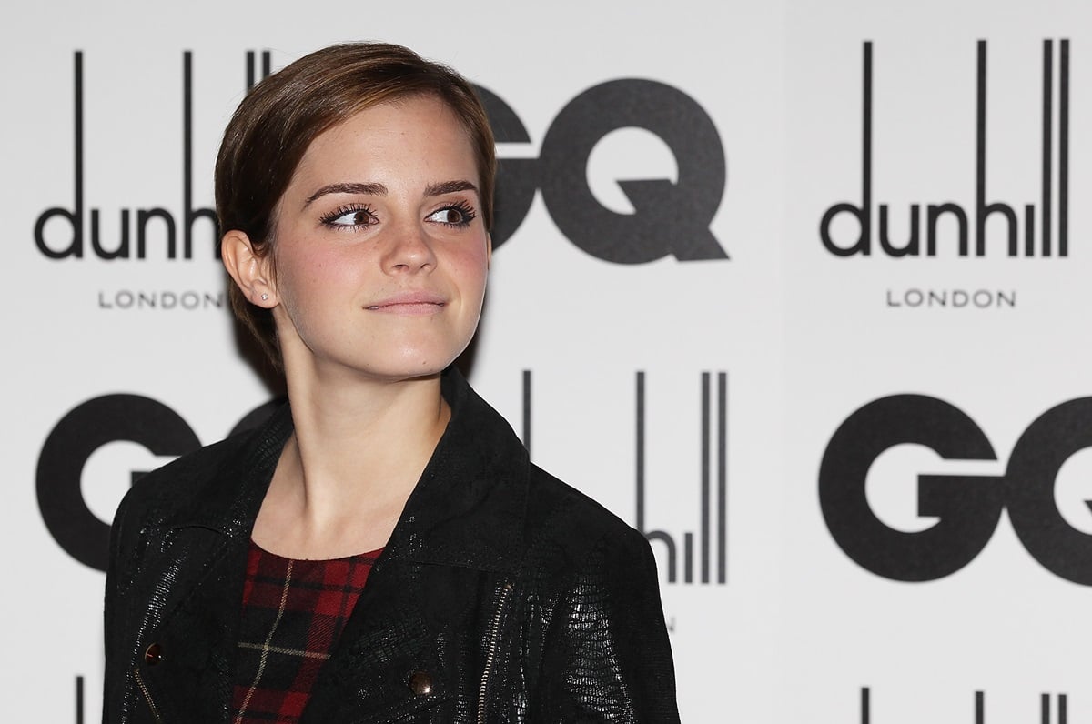 Emma Watson posing in a black leather jacket at the GQ Men Of The Year Awards.