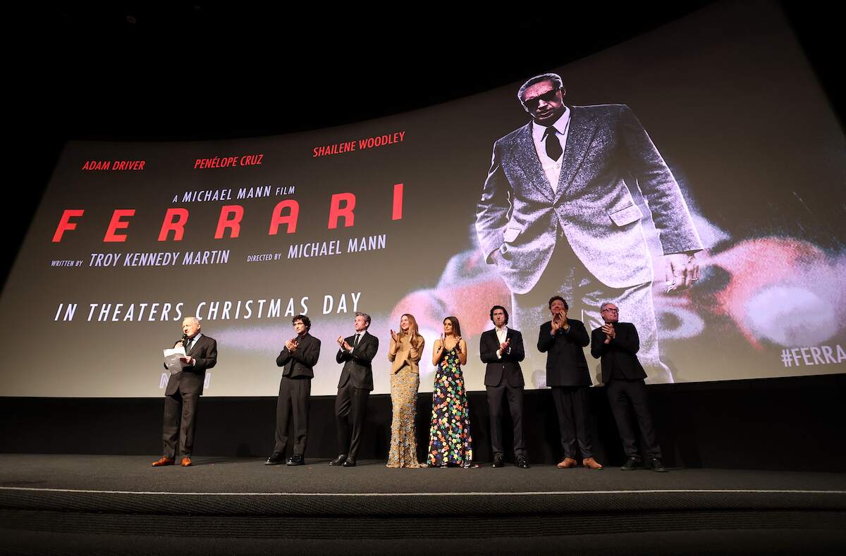 Ferrari Director Michael Mann, Gabriel Leone, Patrick Dempsey, Shailene Woodley, Penélope Cruz, Adam Driver, Producer P.J. van Sandwijk, and Producer John Lesher stand on stage after a screening