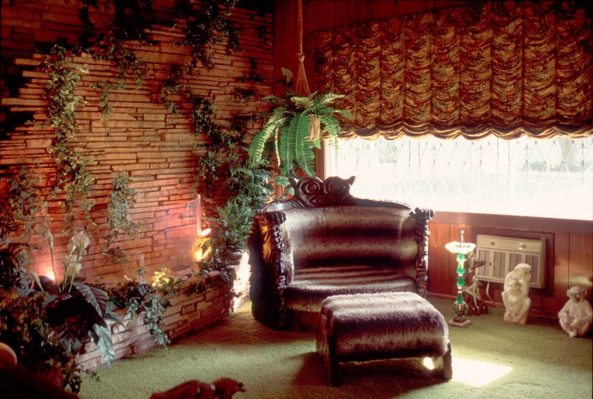 A large arm chair in the corner of the Jungle Room at Graceland. 
