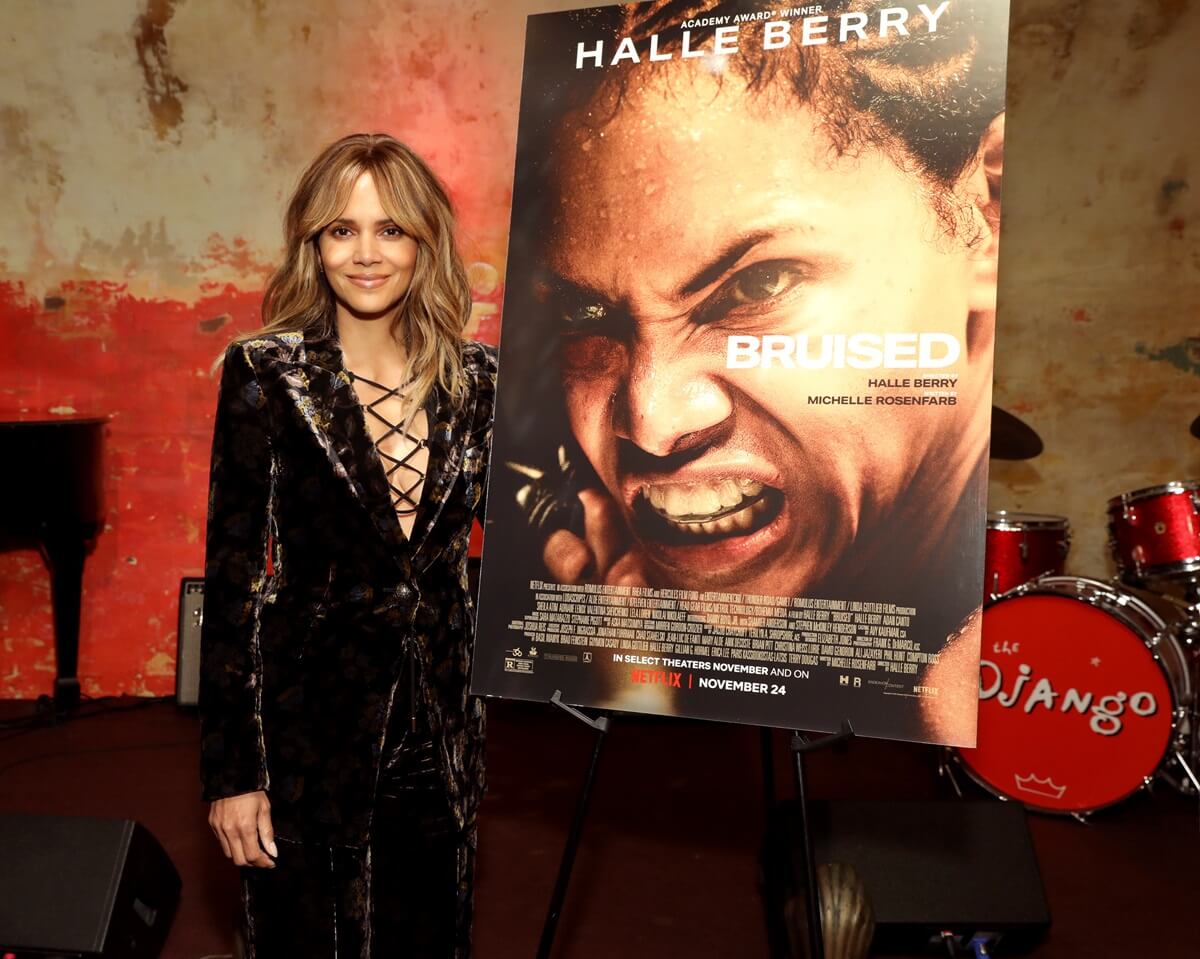 Halle Berry attending the premiere of the Netflix feature 'Bruised' in a black dress.