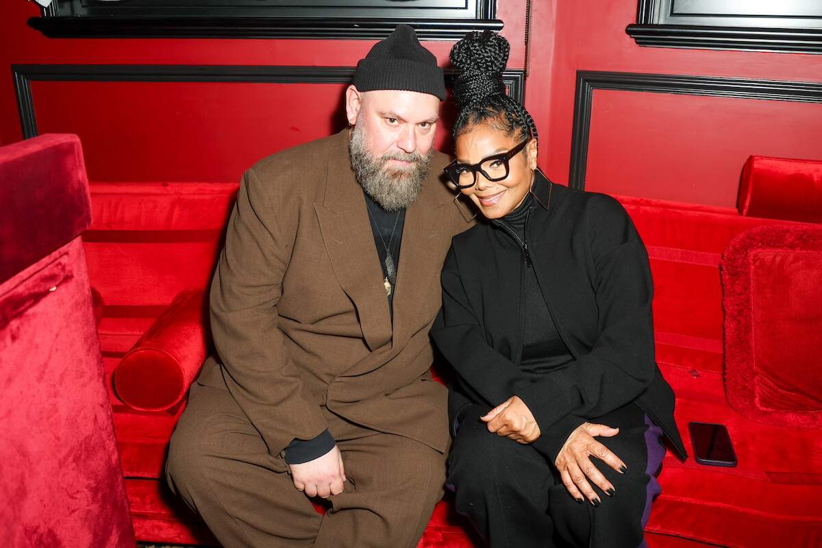 BOSS Creative Director Marco Falcioni and Janet Jackson sit together at a private dinner hosted by Naomi Campbell