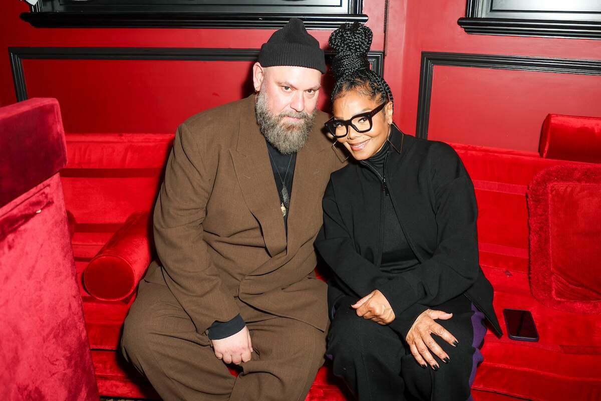 BOSS Creative Director Marco Falcioni and Janet Jackson sit together at a private dinner hosted by Naomi Campbell