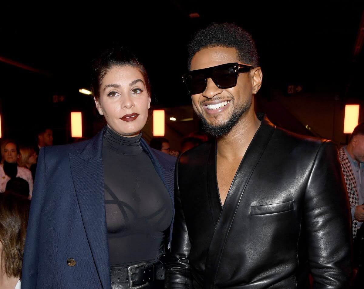 Usher and his girlfriend, Jenn Goicoechea, attend the Balmain show as part of the Paris Fashion Week