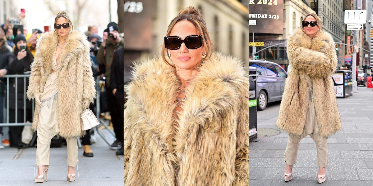 Actor/singer Jennifer Lopez wears a thigh-length tan fur coat and sunglasses