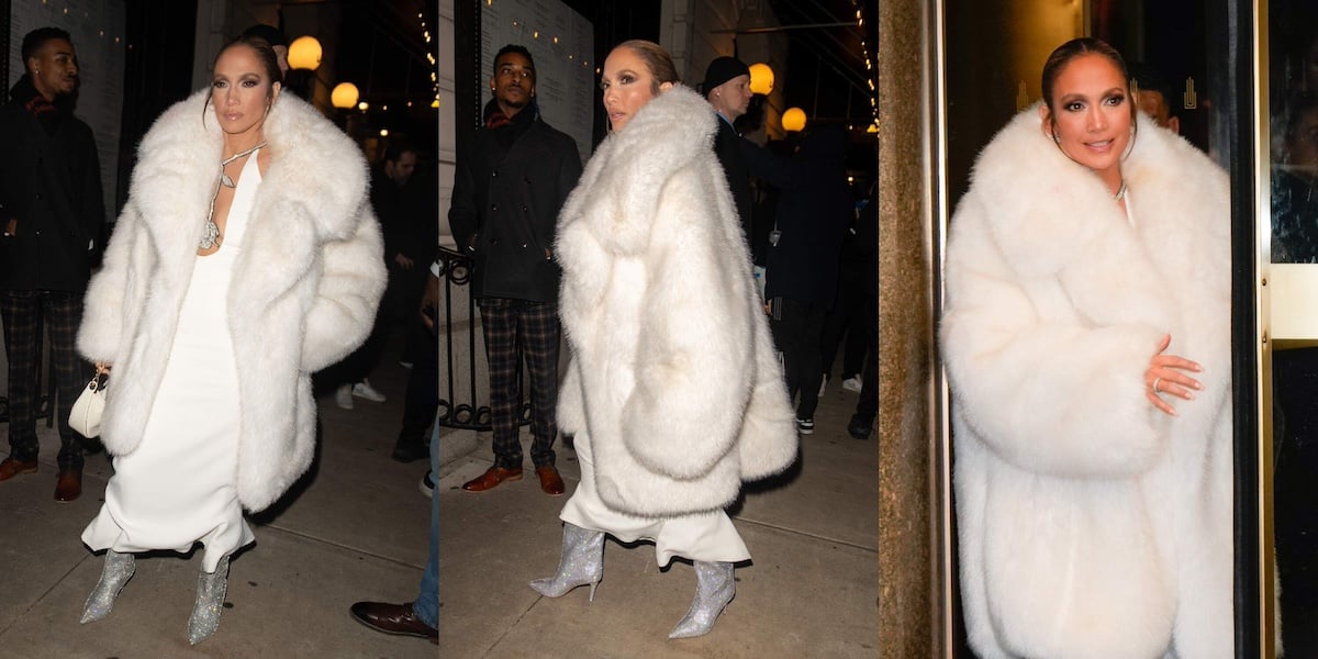 Singer/actor Jennifer Lopez wears a bright white furry coat and white gown on the NYC streets