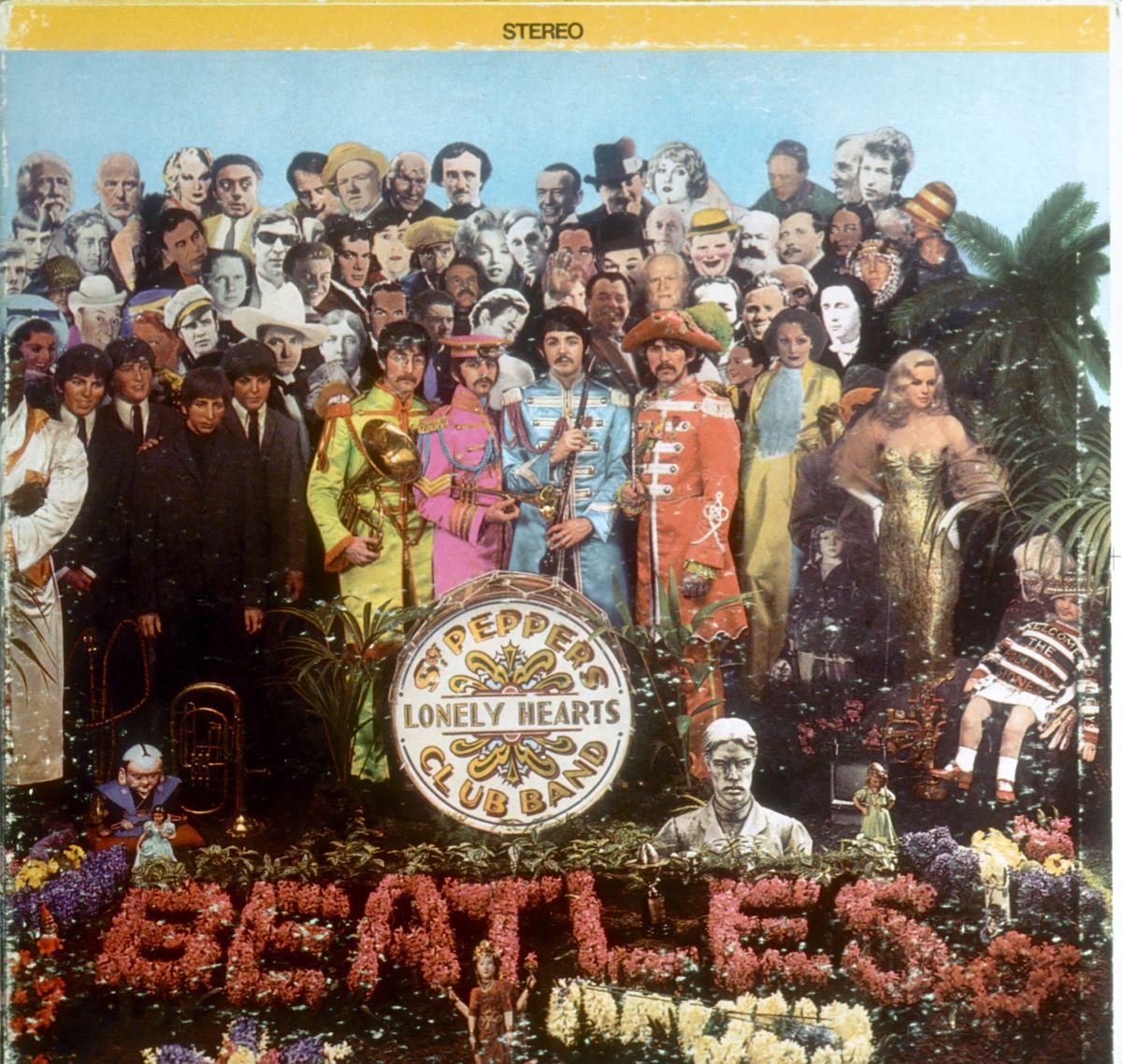The Beatles stand in a crowd of people on the cover of 'Sgt. Pepper's Lonely Hearts Club Band.'