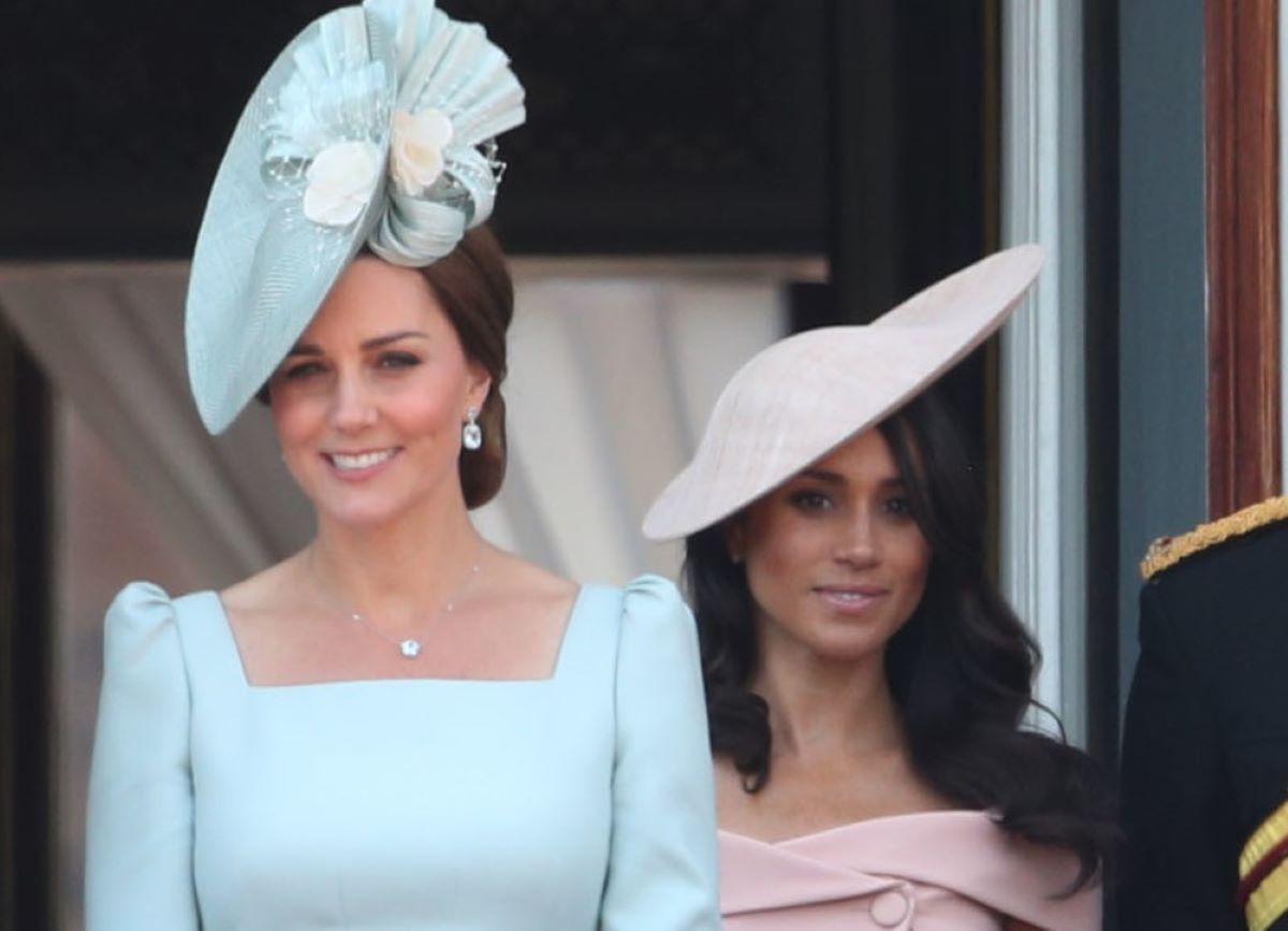 Kate Middleton and Meghan Markle standing on the balcony of Buckingham Palace