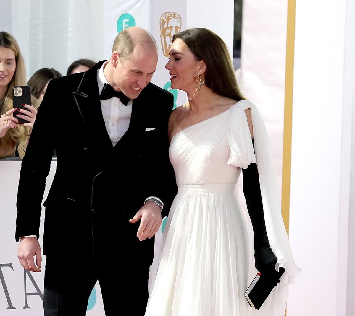 Kate Middleton talking to Prince William as they arrive on the red carpet for the EE BAFTA Film Awards 2023 at The Royal Festival Hall