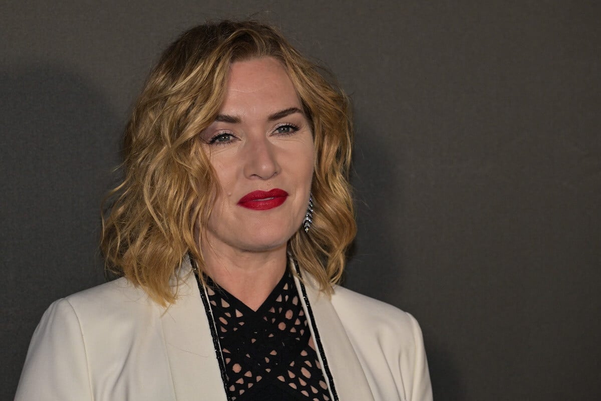 Kate Winslet attending photocall for the L'Oreal Paris event 'Lights on Women' while wearing a white and black suit.