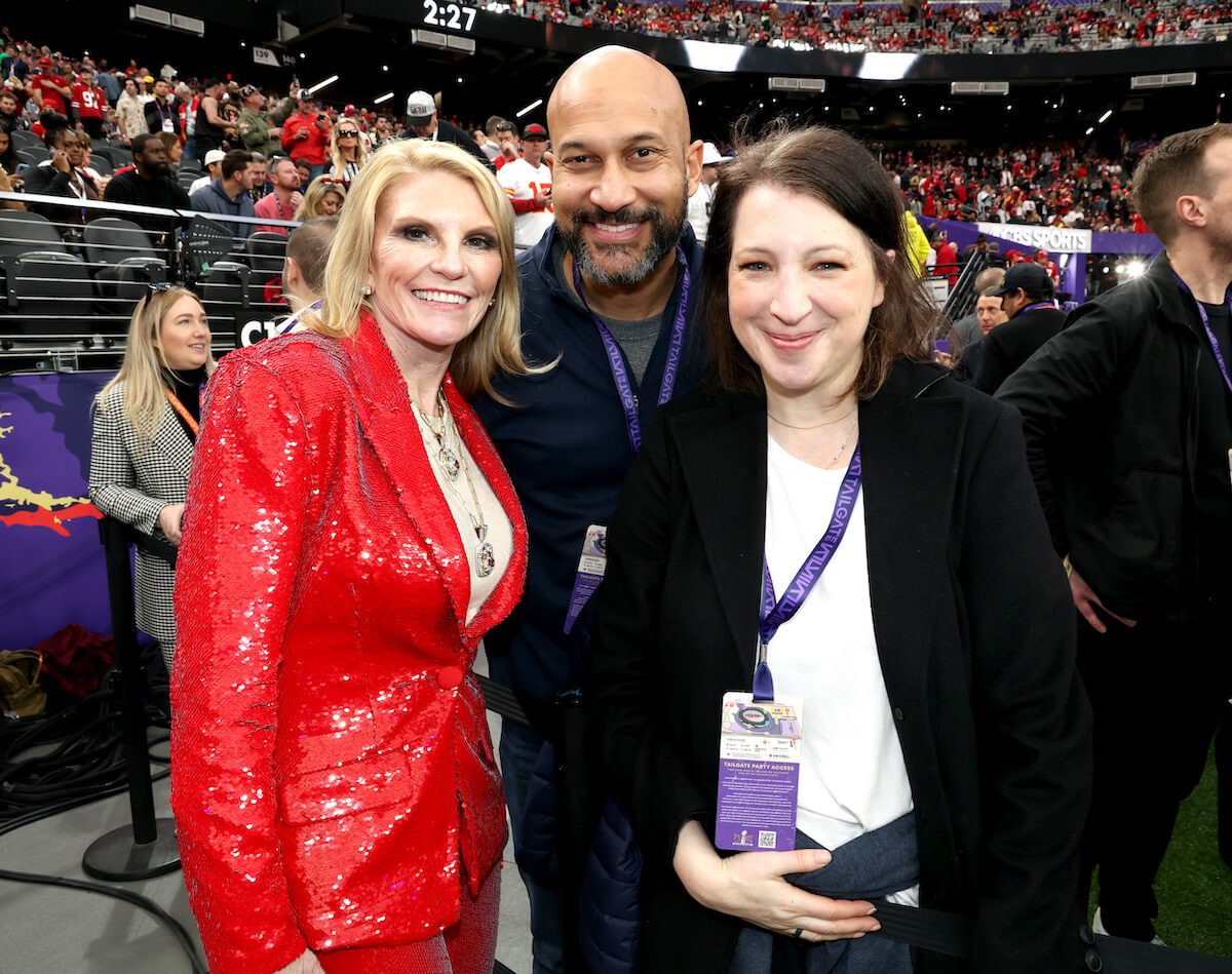 Keegan-Michael Key and his wife Elise Key stand on the Chiefs sideline during Super Bowl LVIII